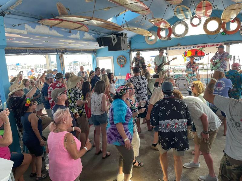 Jimmy and the Parrots keep the Boat Drinks Bacchanal attendees happy with some tropical rock favorites.